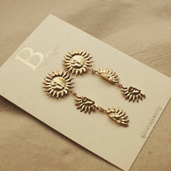 Aretes largos con soles